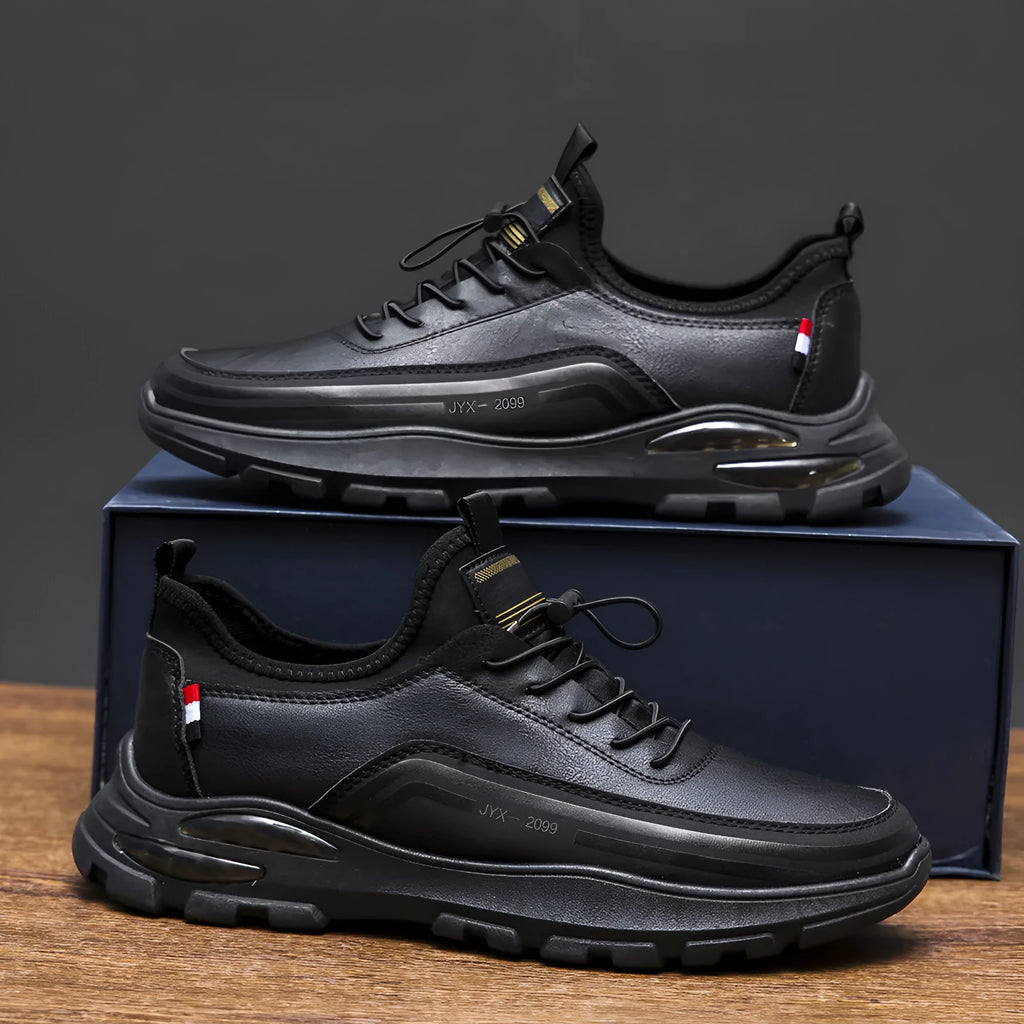 Men's black fleece-lined waterproof sneakers with a round toe and rubber sole on a white background.