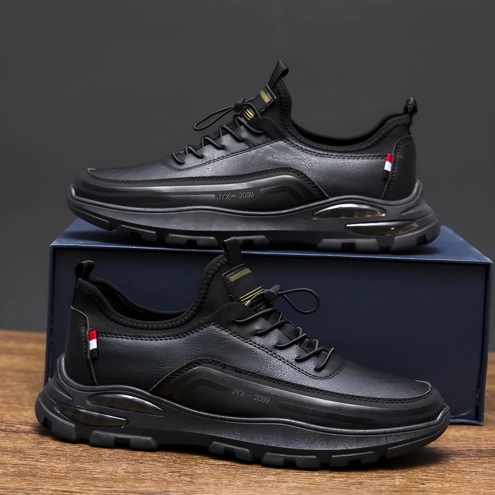 Men's black fleece-lined waterproof sneakers with a round toe and rubber sole on a white background.
