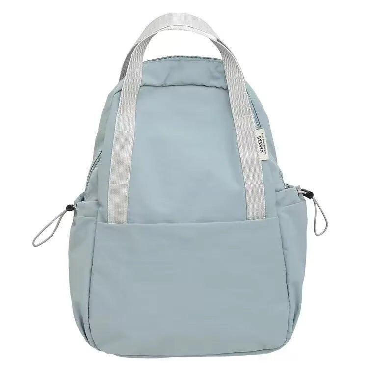 Solid colour nylon backpack in multiple colours with curved shoulder straps, shown in small and large sizes.