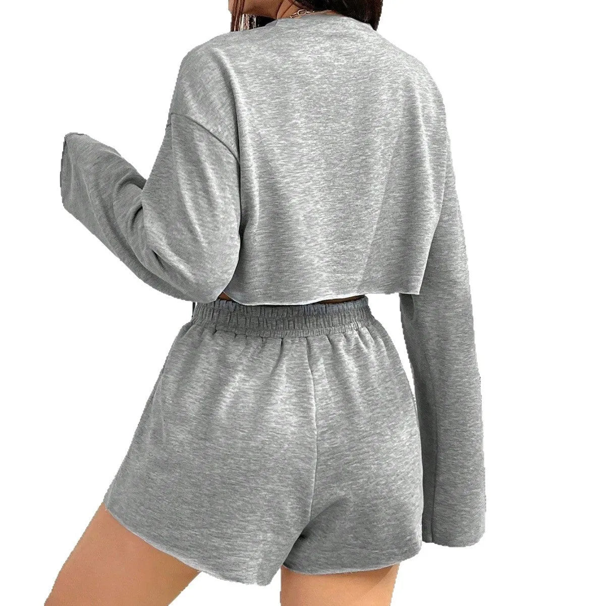 Grey women's long-sleeved T-shirt and matching shorts lounge set laid flat