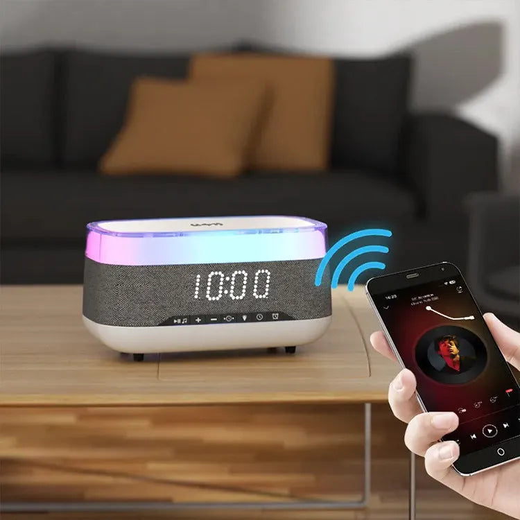 White multifunctional alarm clock with Bluetooth speaker, wireless charging pad, and ambient night light.