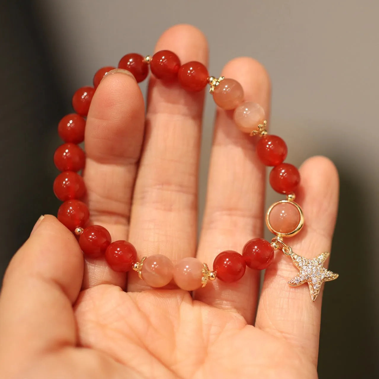 Handmade red agate and Sunstone bracelet with 8mm beads, star design, and ethnic Xiangyun patterning