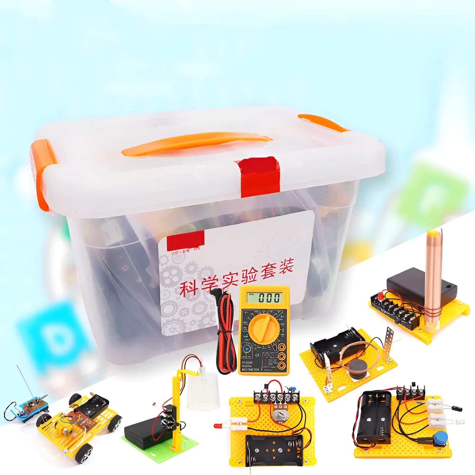 Assembled DIY electronic science set showing a solar fan, hand generator, simple motor, and music doorbell on a table