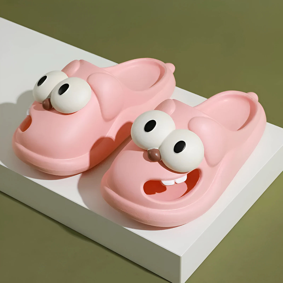 Pair of cartoon big eye dog PVC slippers for women in green colour