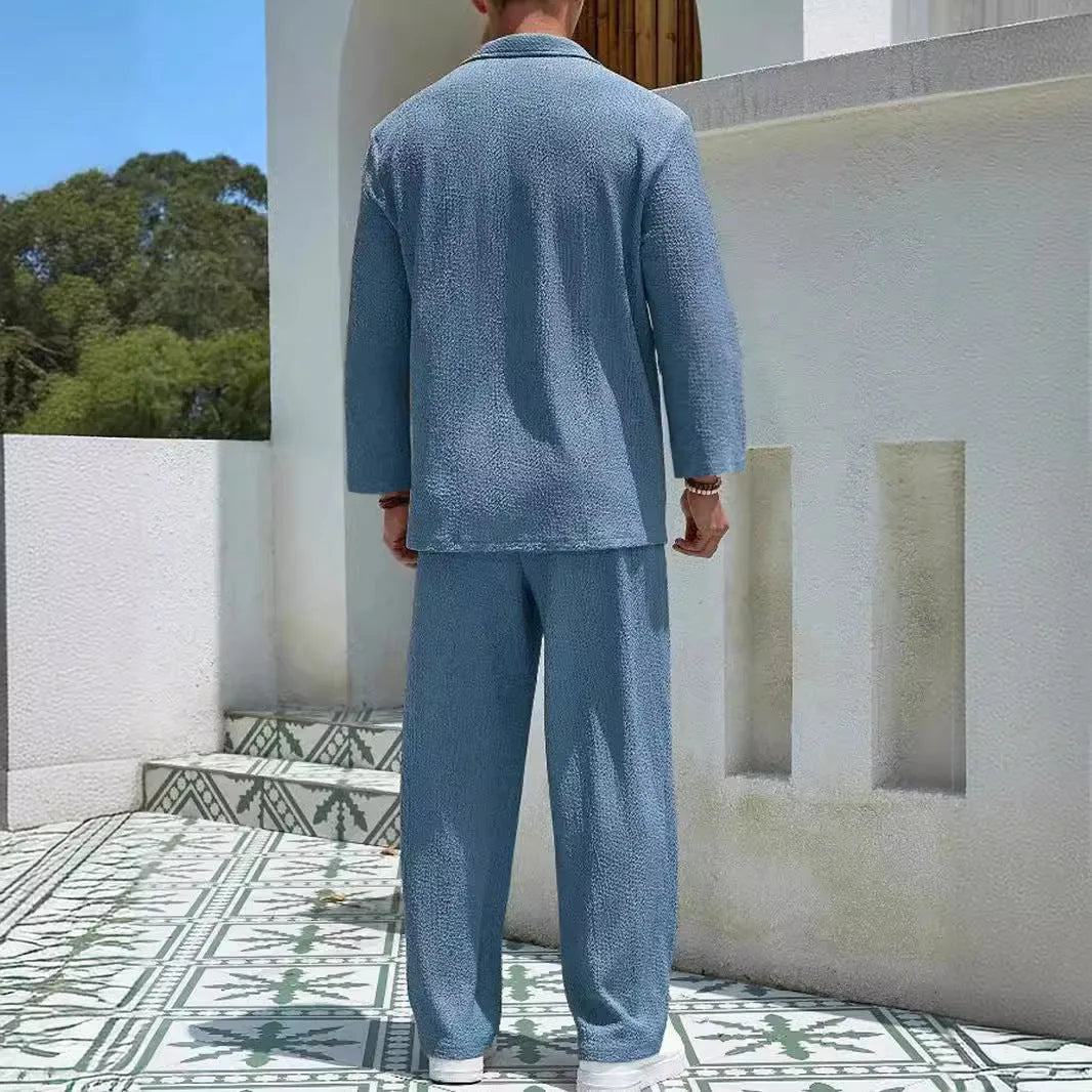 Man wearing a lake blue casual shirt and trouser suit set for autumn leisure.