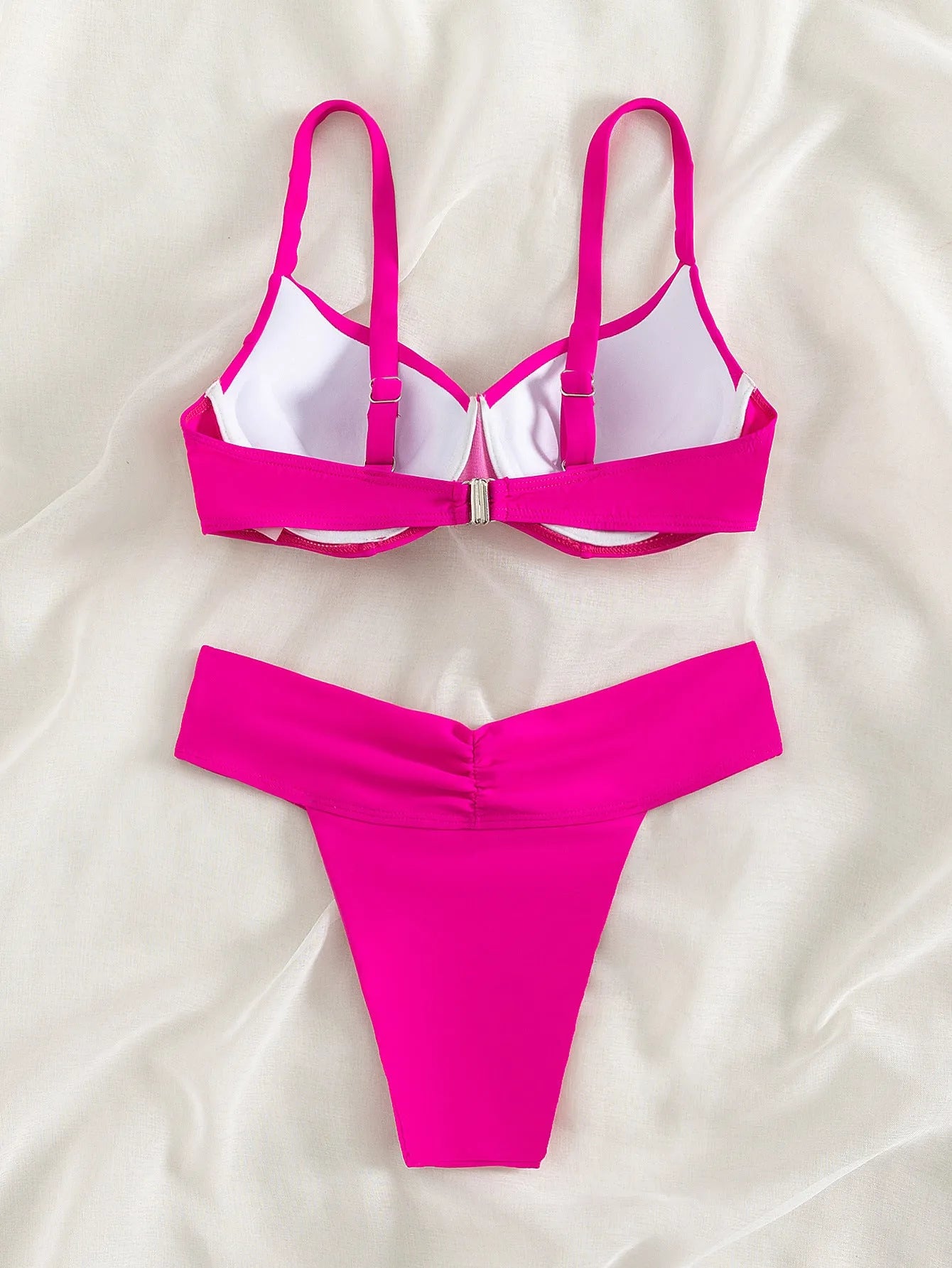 Solid colour briefs-style bikini swimsuit in fluorescent pink, green, blue, or orange, or black.