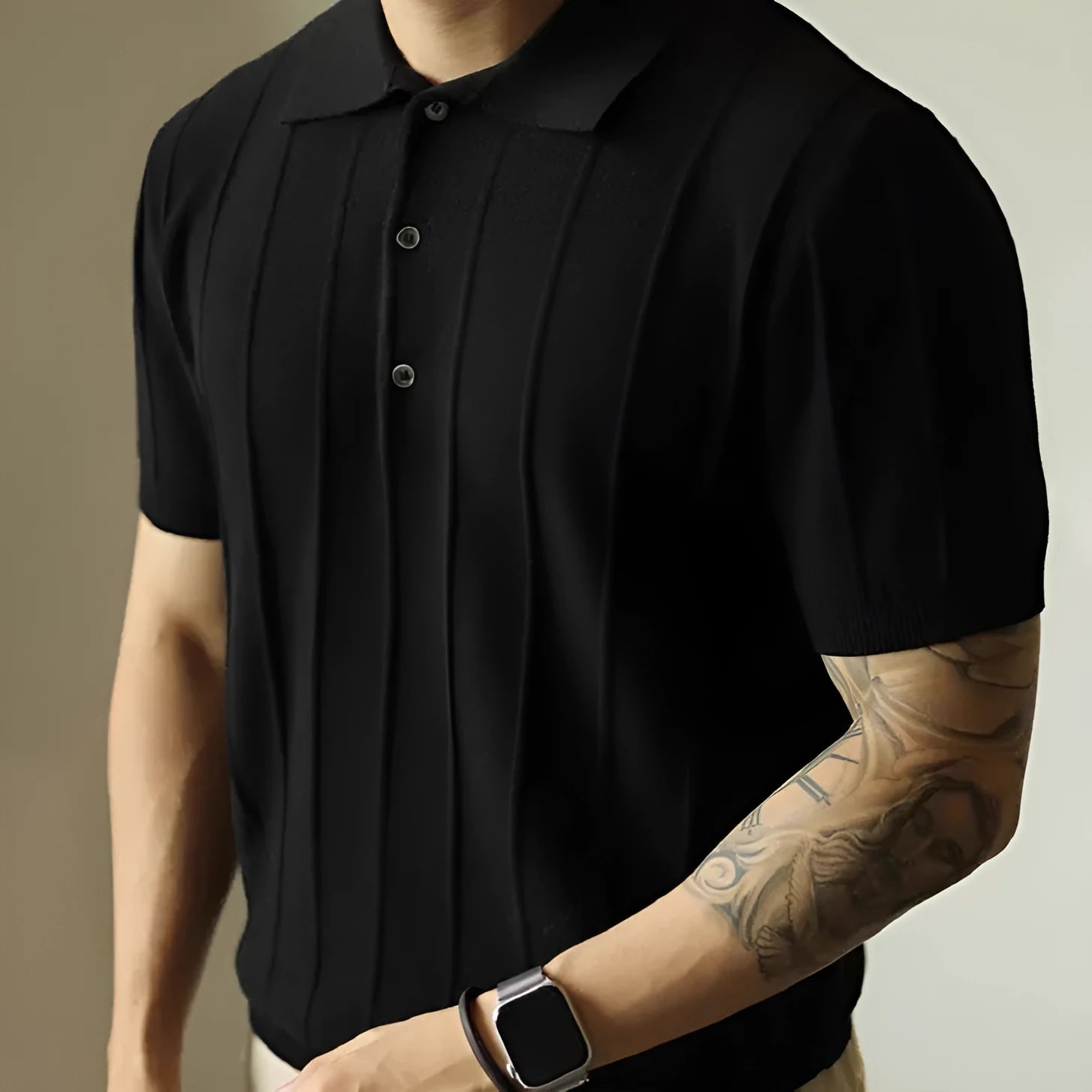 Man wearing a solid black loose fit basic polyester T-shirt for casual wear.