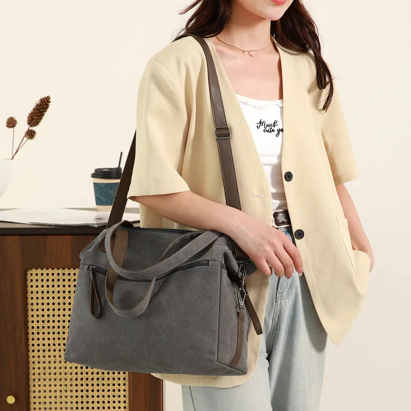 Women's retro style canvas shoulder bag with internal organiser pockets in horizontal square shape