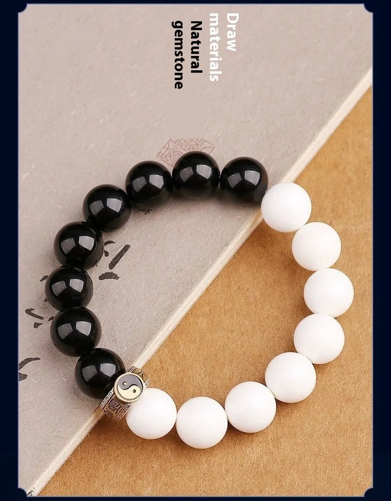 Black and white obsidian bracelet with taiji symbol and mantra bead