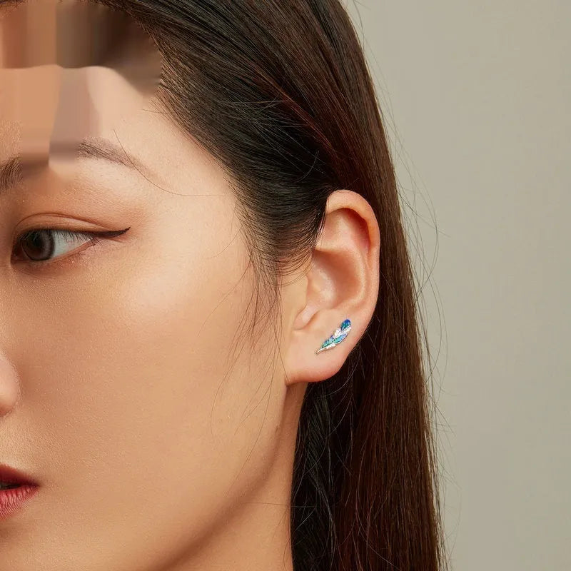 Pair of bright blue gradient feather wing stud earrings white gold plated over 925 silver