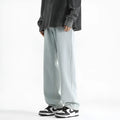 Men's light blue straight leg jeans with button waist in washed denim fabric