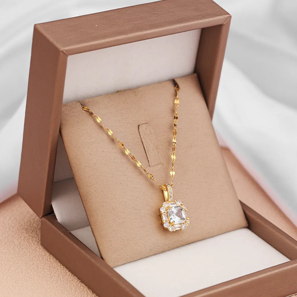 Gold titanium steel clavicle necklace with geometric quadrilateral pendant containing zircon stones