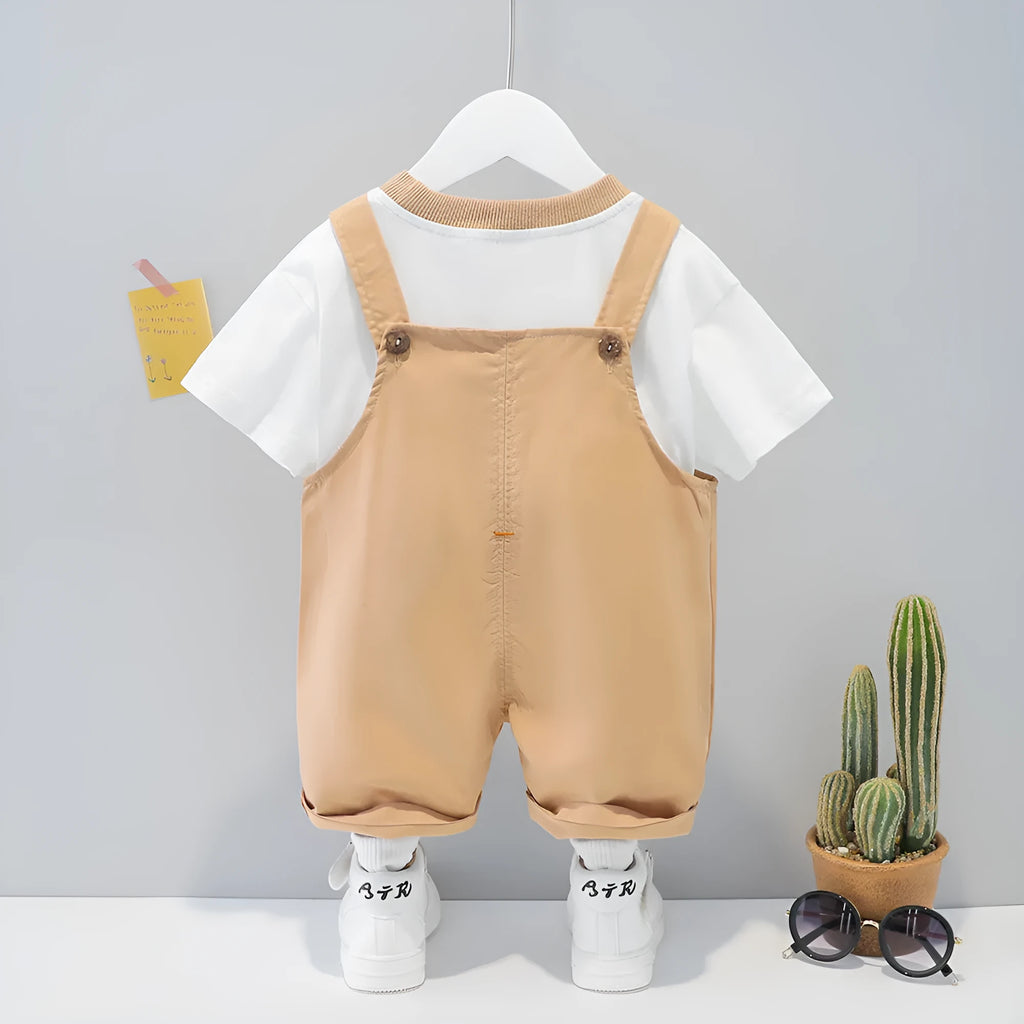 Children's cotton summer overalls with cartoon print in yellow colour showing short sleeves and straps