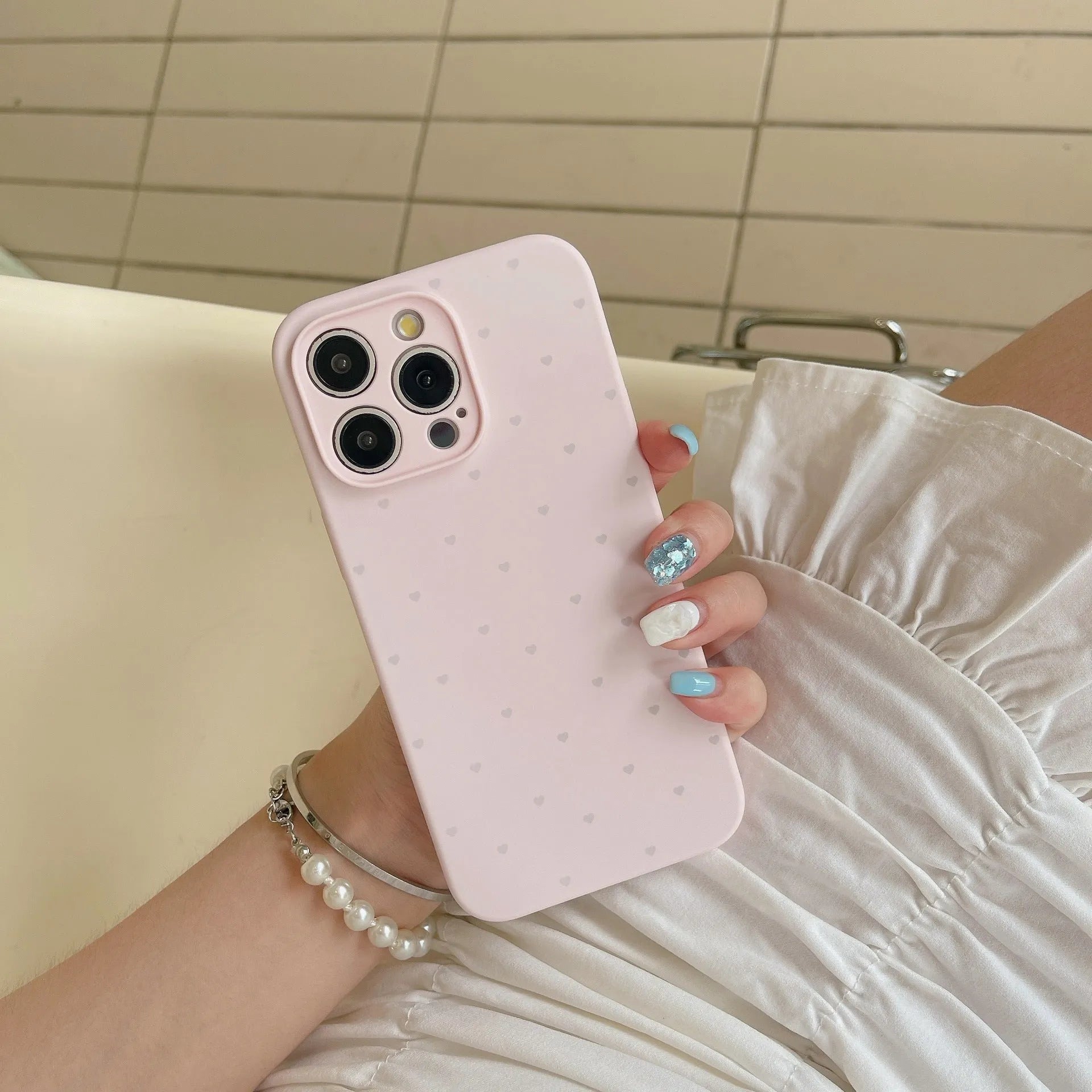 Liquid silicone phone case with love heart design in antique white, fits iPhone 13 Pro Max