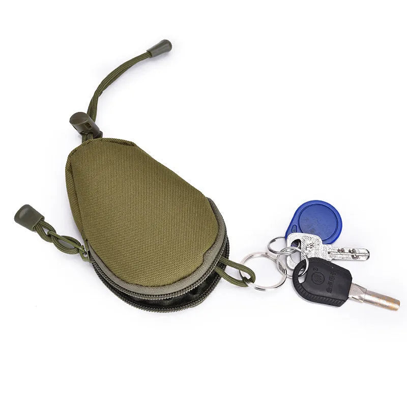 Black Oxford cloth outdoor key bag with zipper, shown next to a telescopic rope.