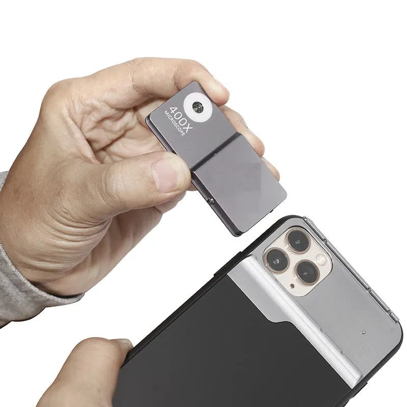 Black and silver 400X mobile phone microscope lens with aluminum alloy TPU case for iPhone.