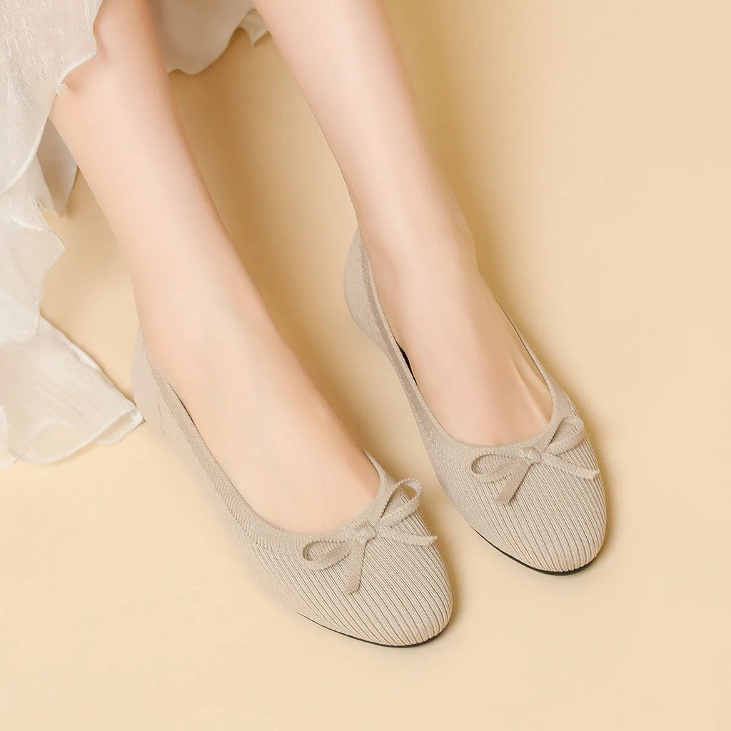 Women's butterfly print flat fabric pumps with round toe and flat heel on a white background.