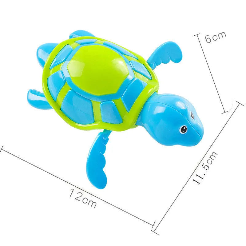 Plastic green turtle baby bath toy floating in water.