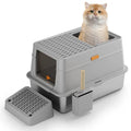 Grey fully enclosed hooded cat litter box with a foot pedal next to the front entrance door.