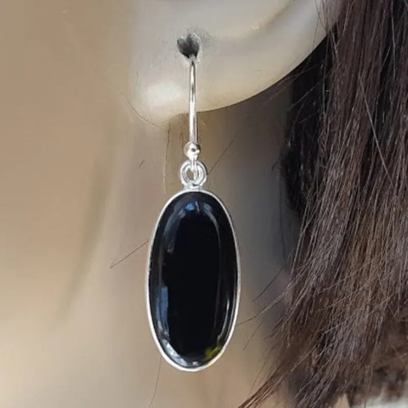 Women's black oval agate pendant earrings with 925 silver detail and geometric Chinese design