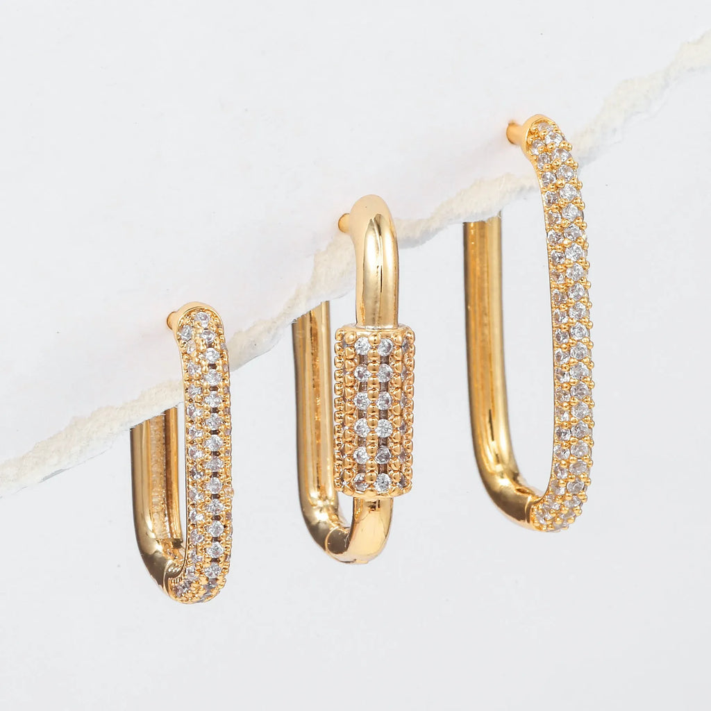 Set of three geometric square clip-on earrings with inlaid zircon detail in gold and white gold tones.