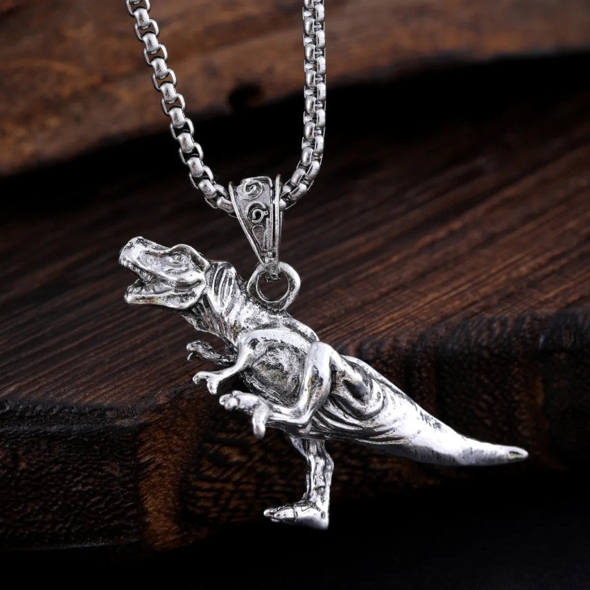 Titanium dinosaur pendant necklace in hip hop style, unisex versatile jewellery in dinosaur necklace colour