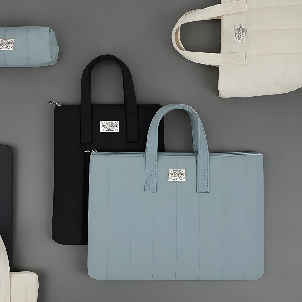 Personalised polyester laptop briefcase in milky white, shown with size options for 11, 13-14, and 15-15.6 inch devices.