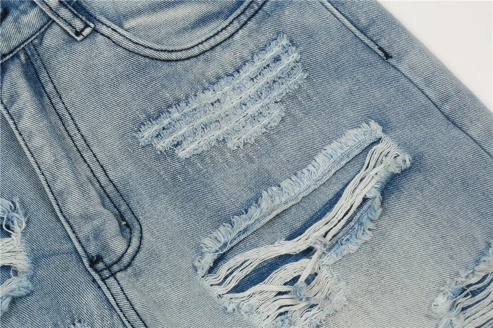 Men's flared washed jeans in light blue denim with zipper fly