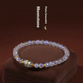 Moonstone women's bracelet with hand-ground beads and animal zodiac charms in fashion blue light colour