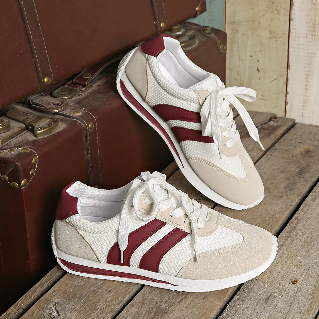 Wine red Cortez retro sneaker with cross strap and breathable mesh surface.