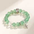Green fluorite bracelet with star and moon princess design showing natural stone asterism patterns