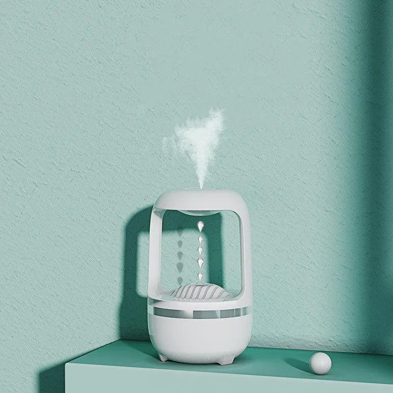 Black plastic anti-gravity water drop humidifier with USB cable, round shape, atmosphere lamp on desk