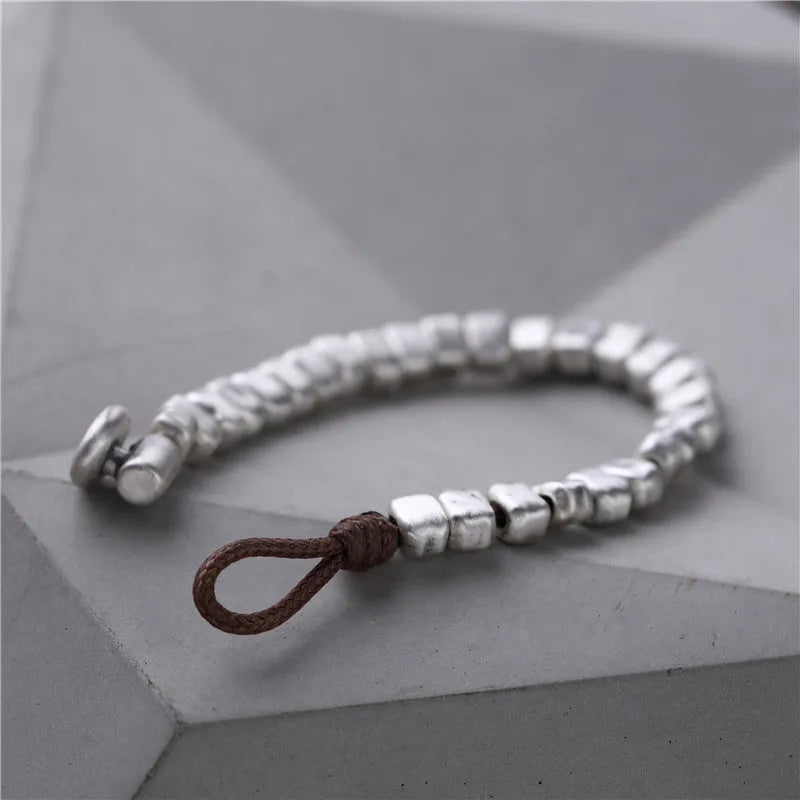 Women's handmade silver bracelet with wooden irregular square design on elasticated band
