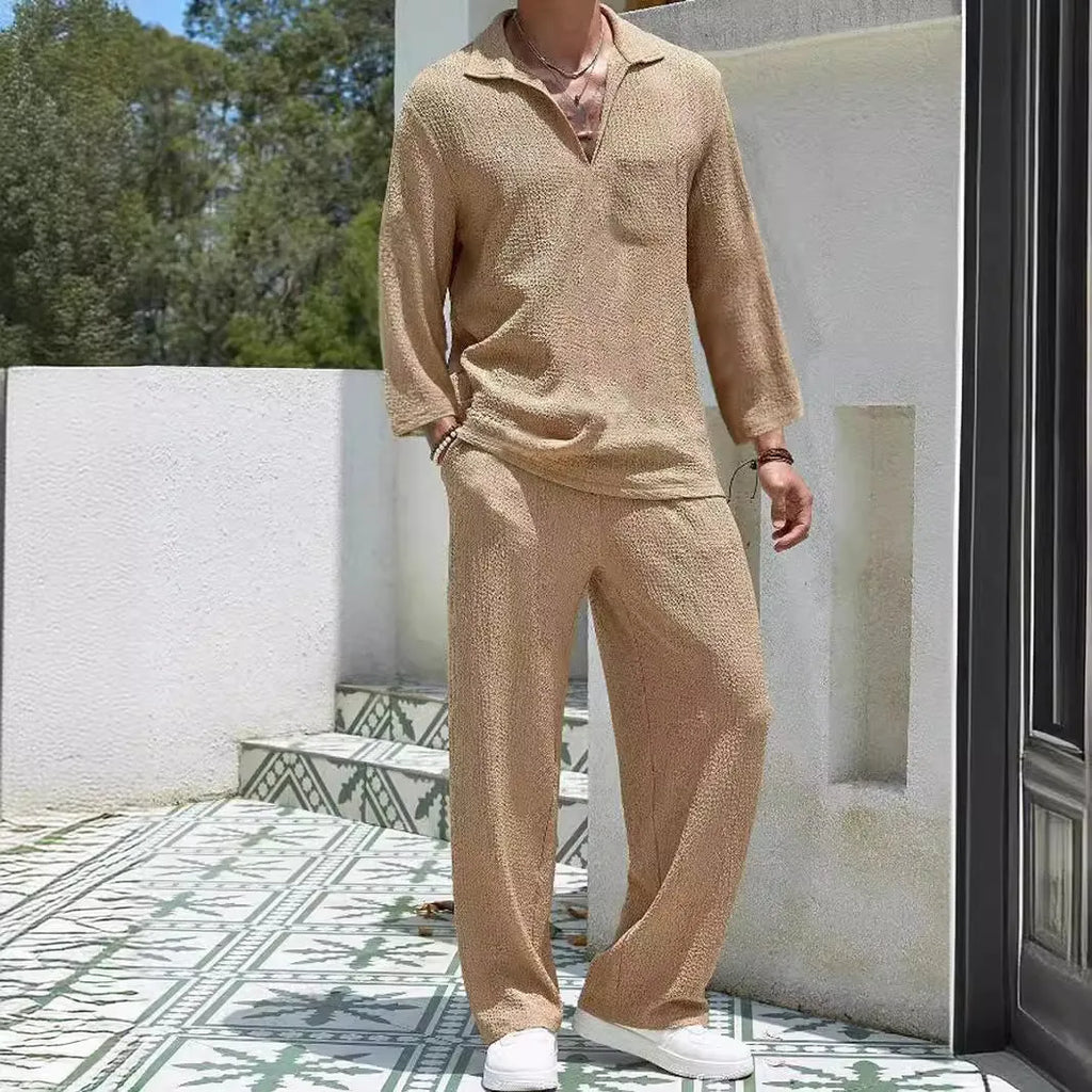 Man wearing a lake blue casual shirt and trouser suit set for autumn leisure.