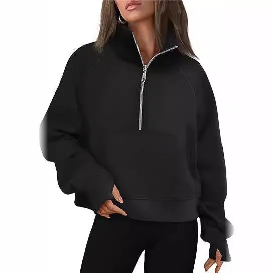 Woman wearing a loose lapel fleece-lined sweater in a solid colour, showing raglan sleeve detail.