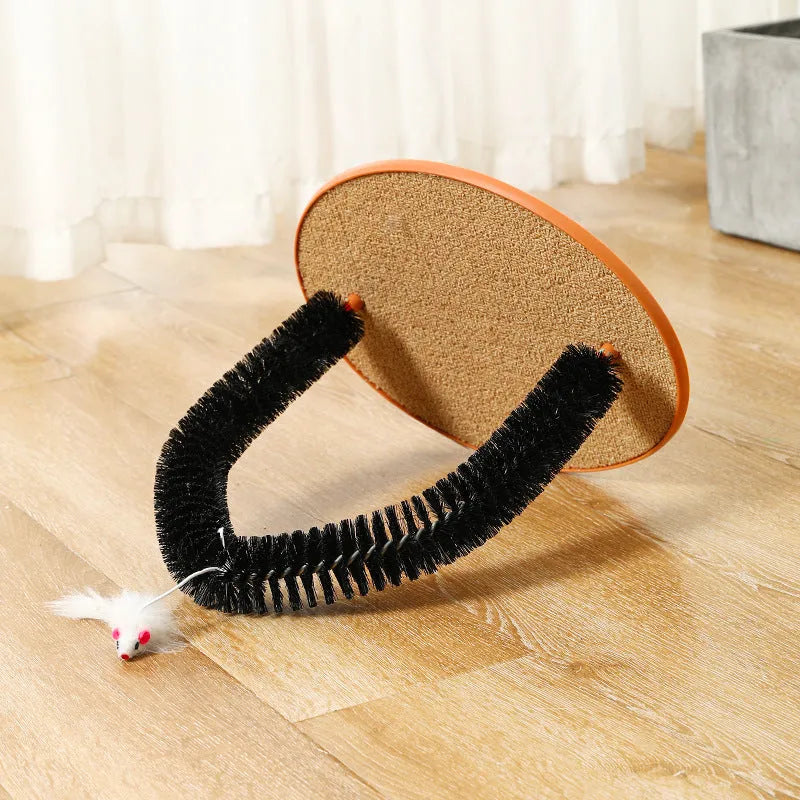 Black arch-shaped cat scratching post with grooming brush and attached mouse toy on non-slip base