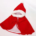 Small dog wearing red Christmas cloak shawl with cloth fabric construction
