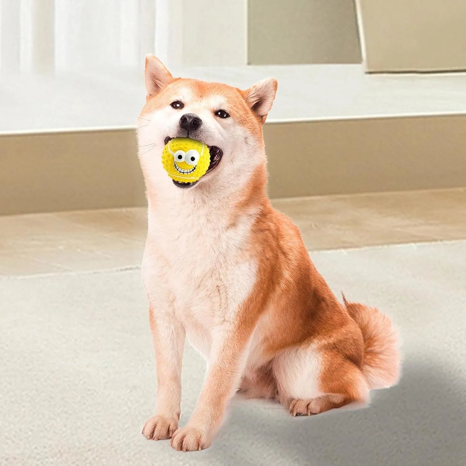 Green latex squeaky dog ball with smile face design for fetch and chew play