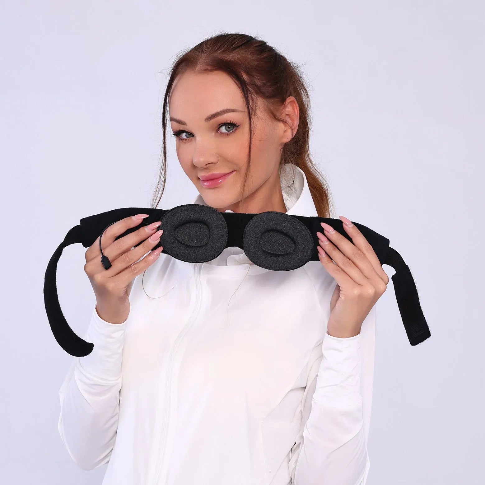 Grey Bluetooth sleeping eye mask with outline design showing integrated speaker placement