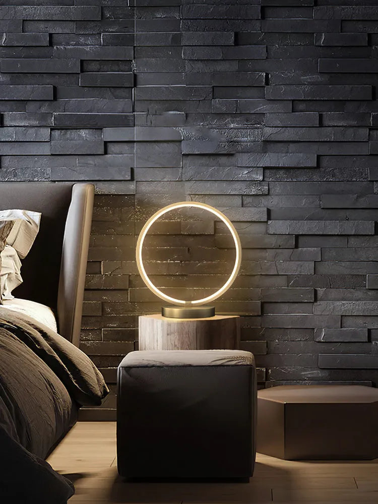 All copper Nordic style table lamp with tri-tone LED light, push button switch, on a wooden desk
