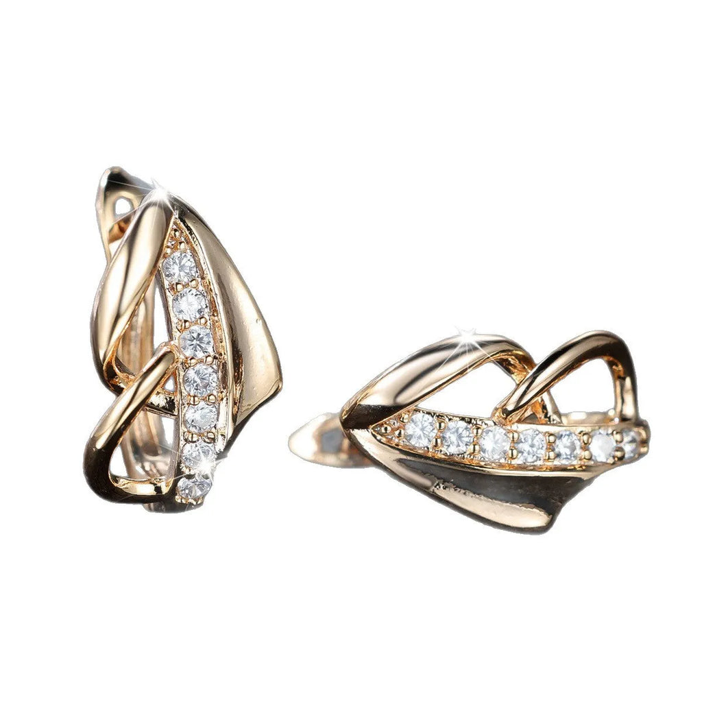 Champagne gold copper ear clip with white diamond centre, geometric arrow shape