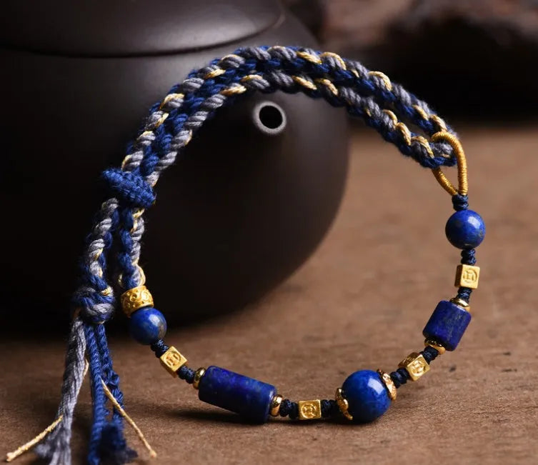 Close-up of a hand-woven flexible wire bracelet for women with a Lapis Lazuli stone accent.