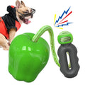 Green plastic dog molar chew toy with dropping ball food dispenser mechanism