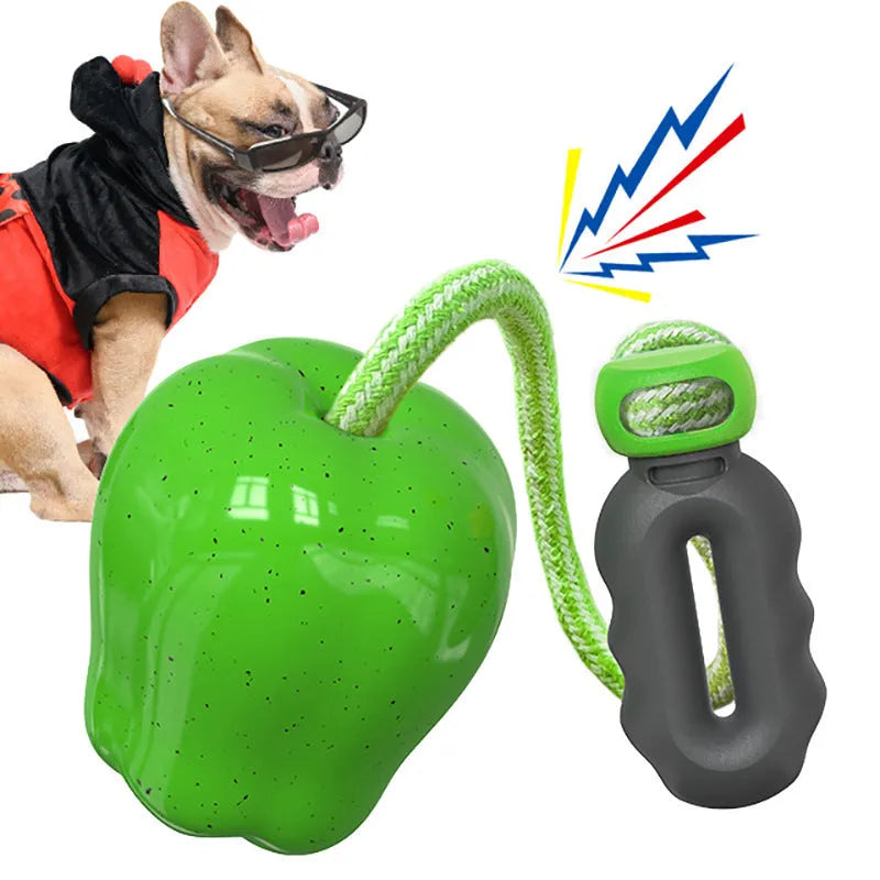 Green plastic dog molar chew toy with dropping ball food dispenser mechanism