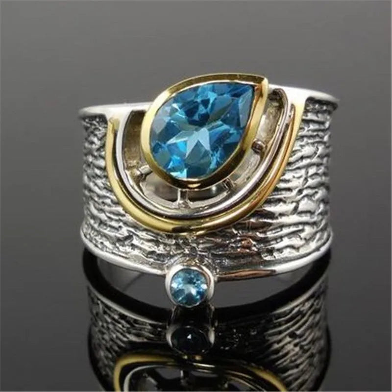 Blue rhinestone zircon ring with a Chinese style drop shape on an alloy band.