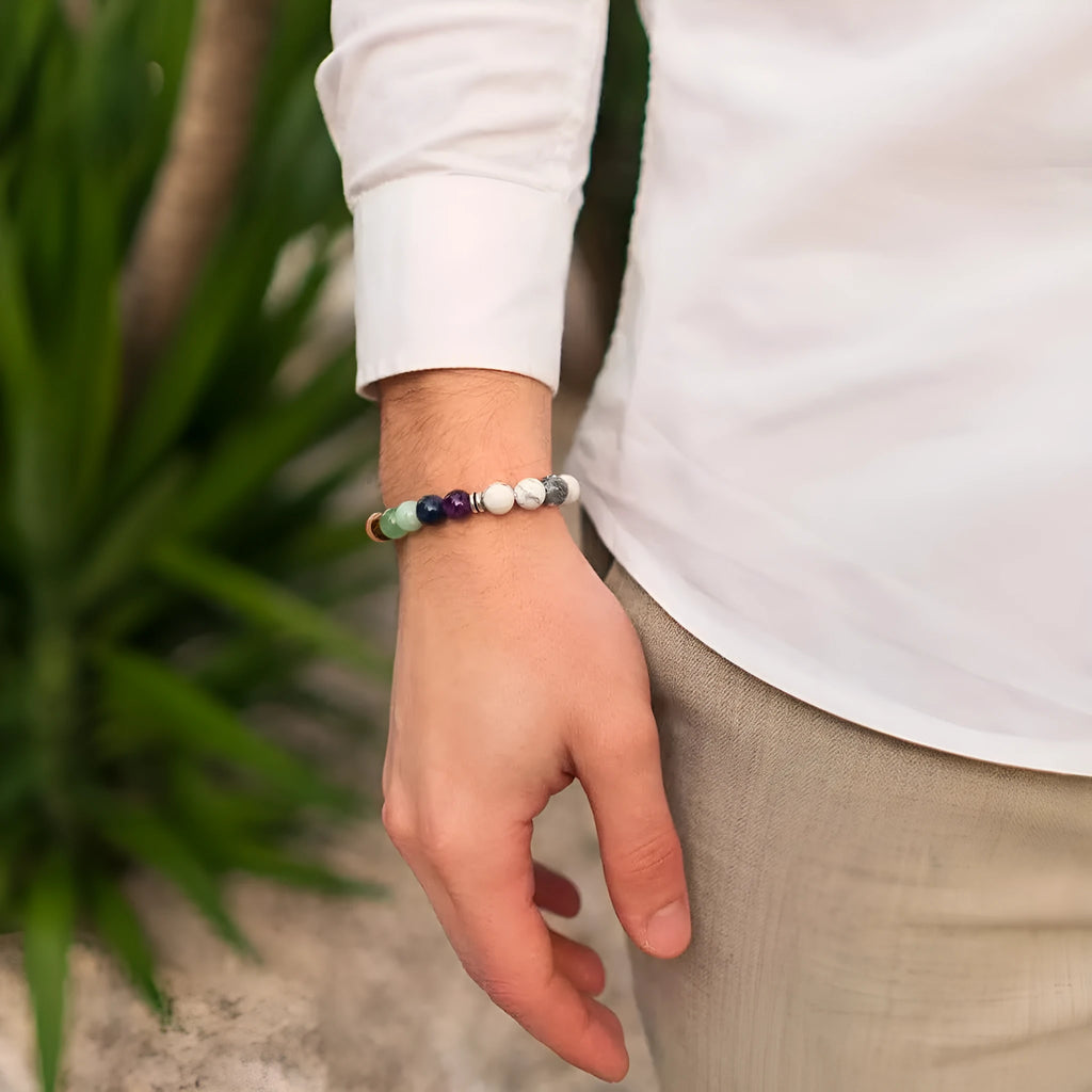 Close-up of a women's flat knot braided aquamarine bracelet showing hand-woven texture and geometry patterns.