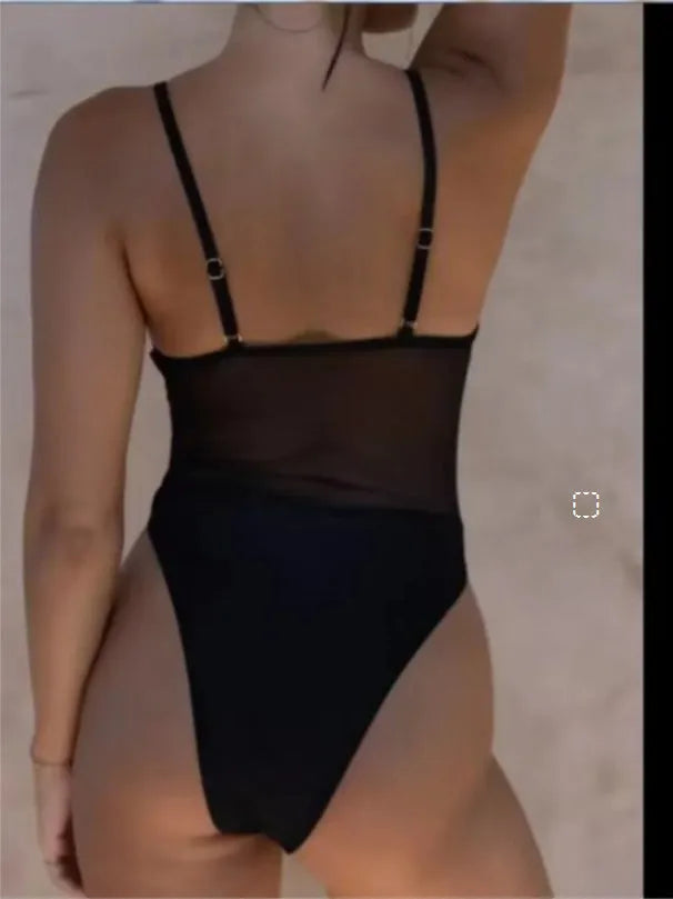 Women's black polyester banded bikini one-piece swimsuit for beach and sunbathing