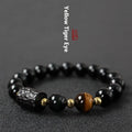 Obsidian bracelet with tiger eye beads in 10mm size showing manual craftsmanship and unisex design