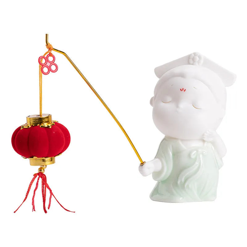 Cute ceramic female court attendant figurine incense burner decoration on a desk.