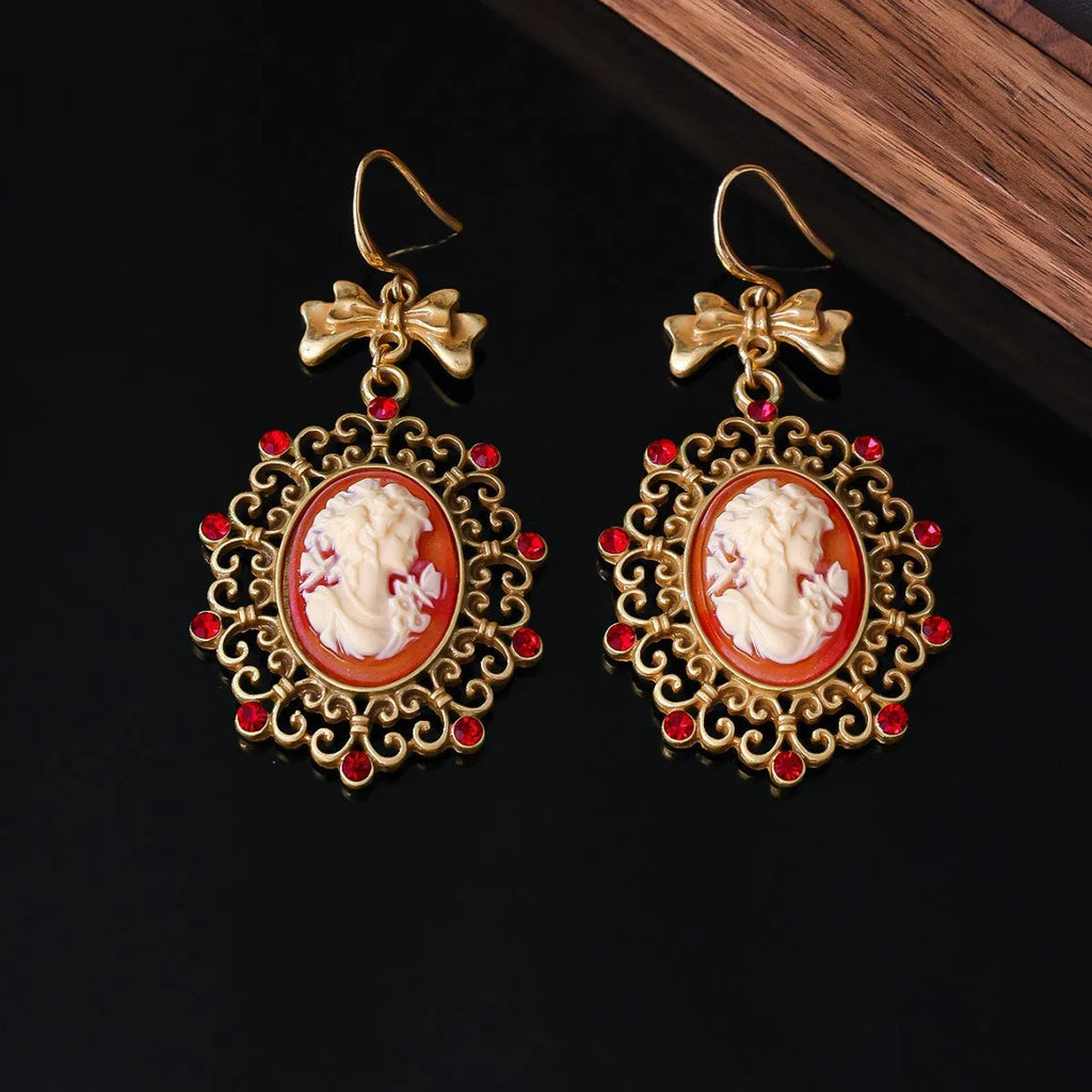 Retro court beauty head earrings in alloy with bow detail and electroplated finish, Beauty Head Ear Drops colour.